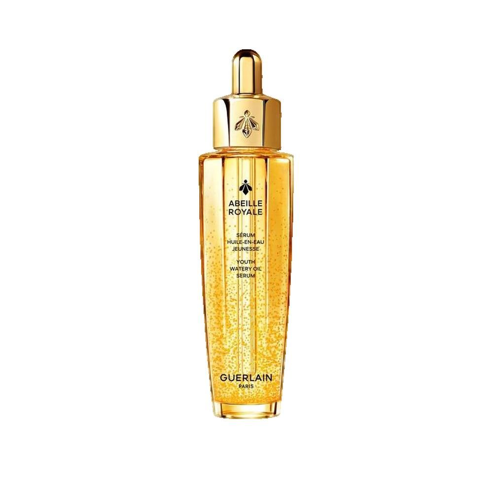 Goldfarbene Flasche mit goldenem Deckel. Aufschrift: Abeille Royale, Sérum Huile en Eau Jeunesse, Guerlain Paris.