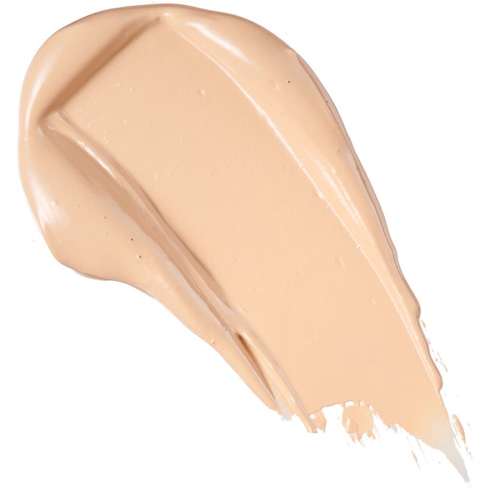 Beige Concealer-Abstrich. Cremige Textur, helle Farbe. Auf weißem Hintergrund.