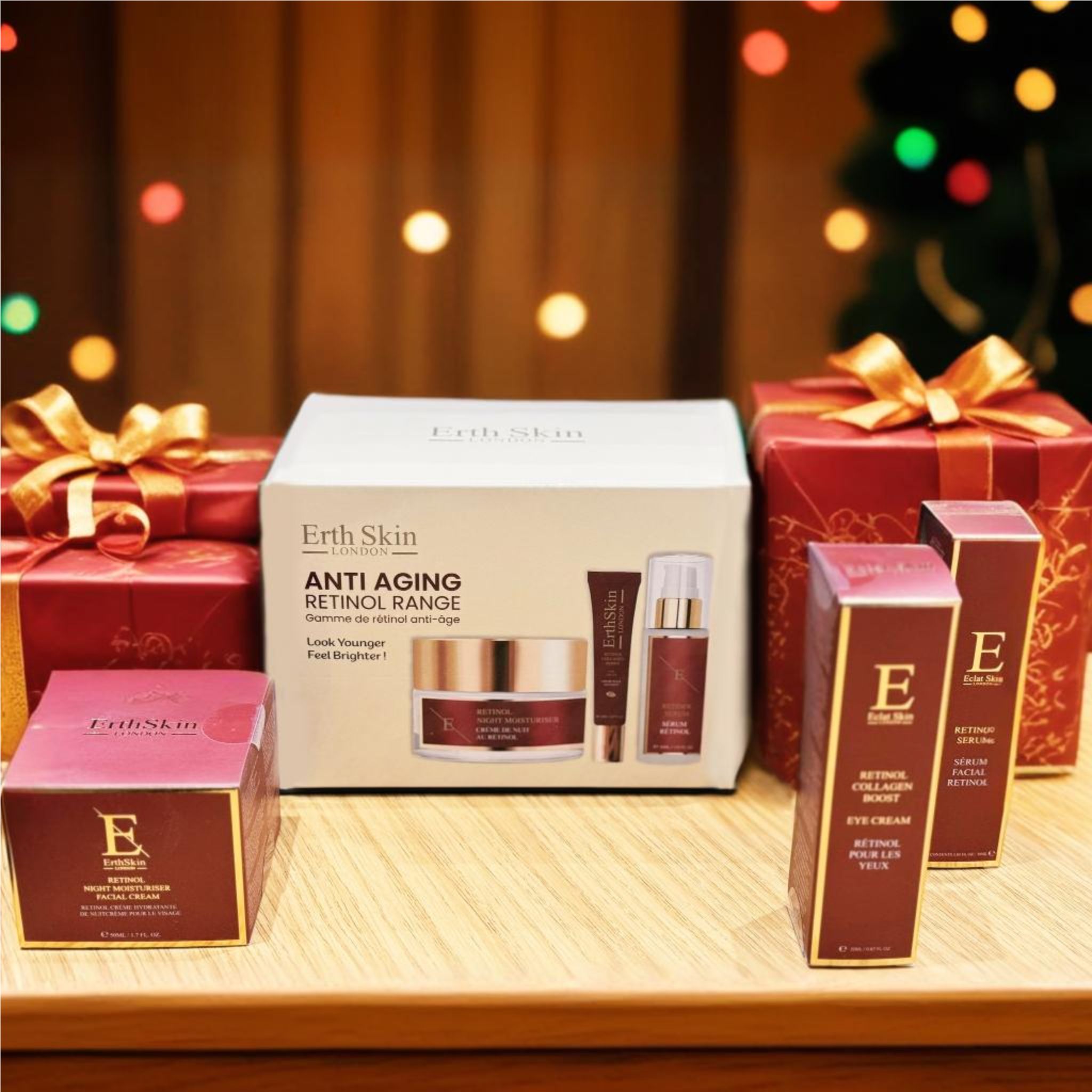 Geschenkbox mit Hautpflegeprodukten, umgeben von Geschenkboxen. Enthält Creme, Serum und Augencreme. Aufschrift: Anti-Aging Retinol Range.