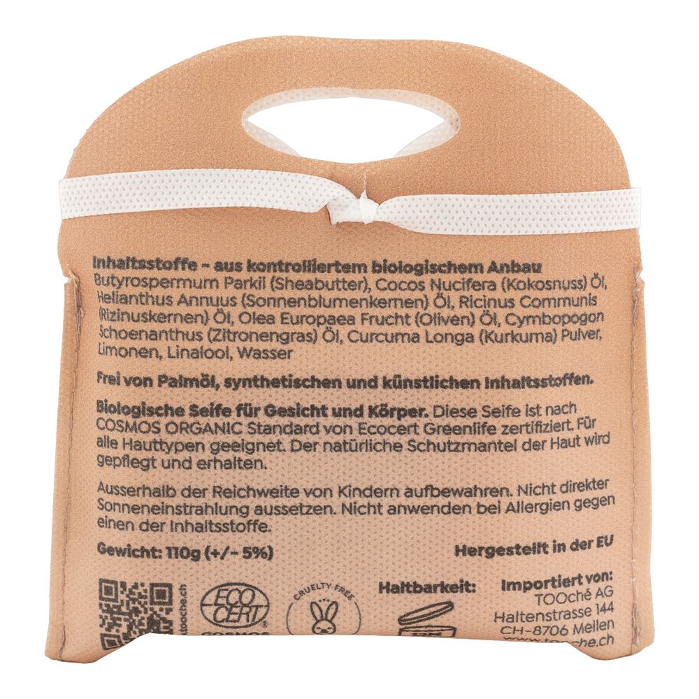 Rückseite der Seifenverpackung. Text mit Inhaltsstoffen, Gewicht, Zertifizierungen und Herstellerinformationen.