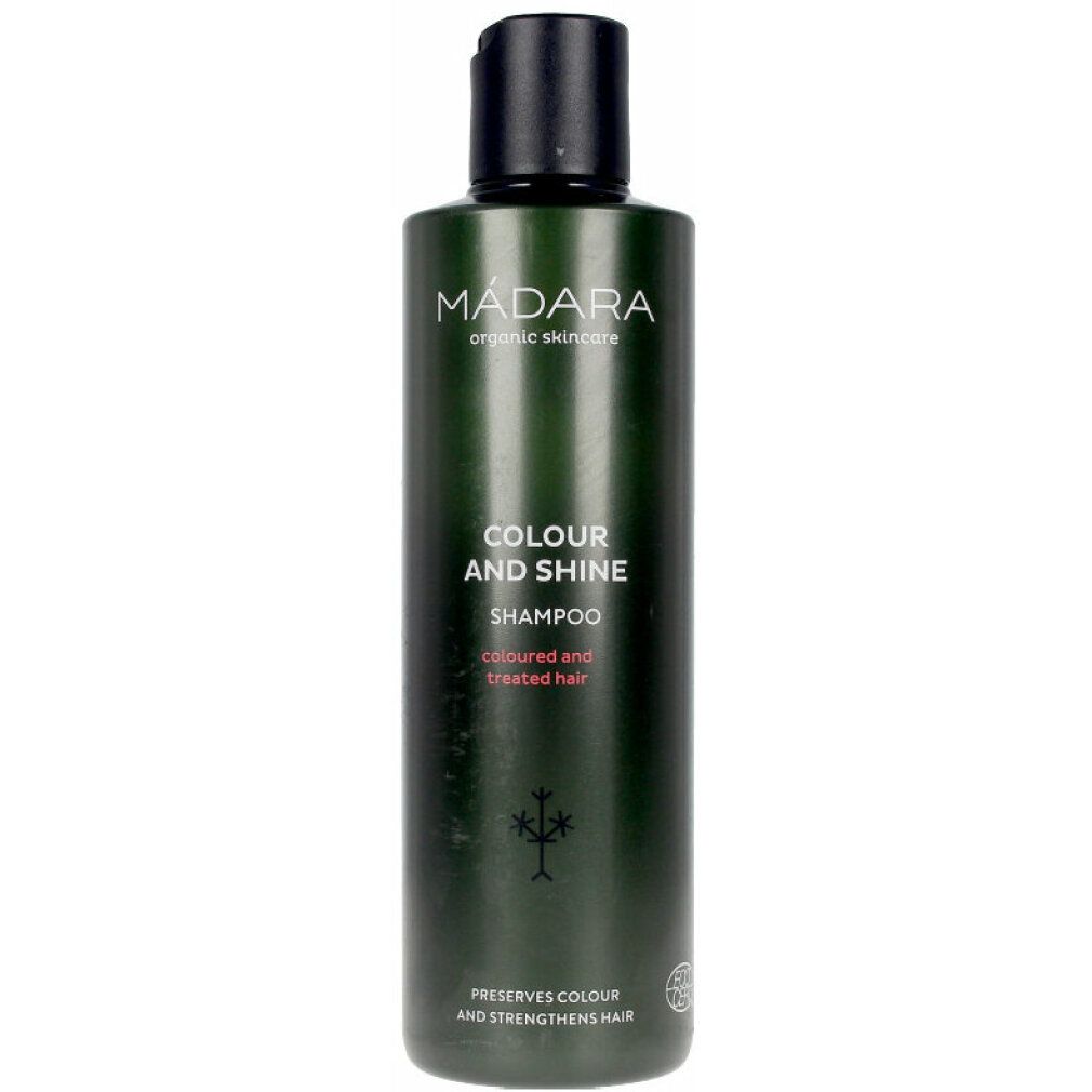 Grüne Flasche mit Shampoo. Aufschrift: MÁDARA, Colour and Shine, Shampoo. Für coloriertes Haar. Mit Logo.