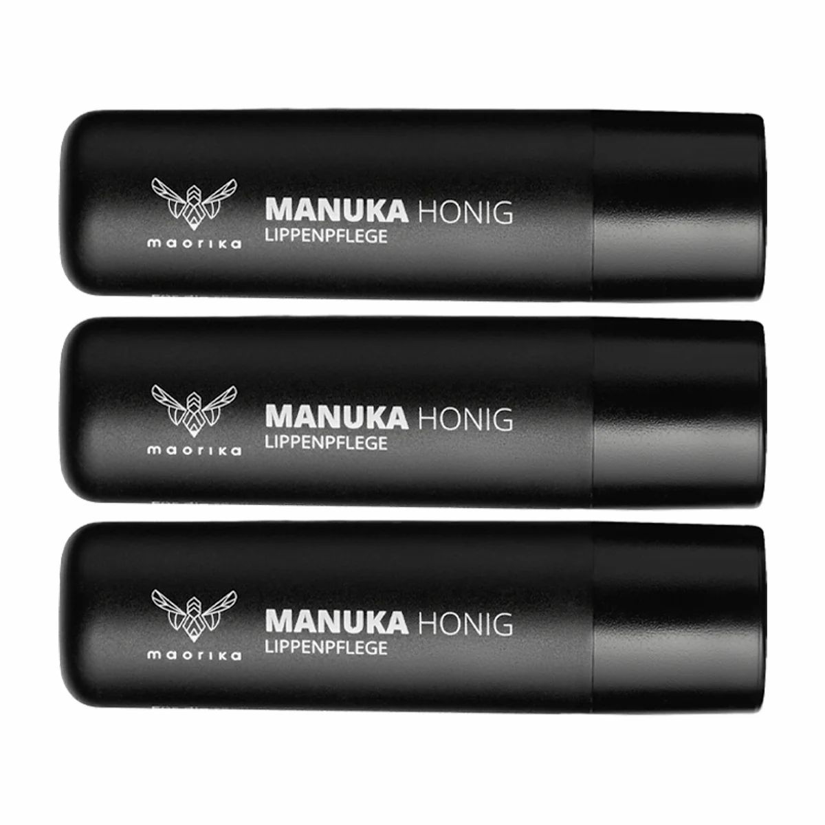 Drei schwarze Lippenbalsam-Stifte mit Manuka Honig und dem maorika Logo.