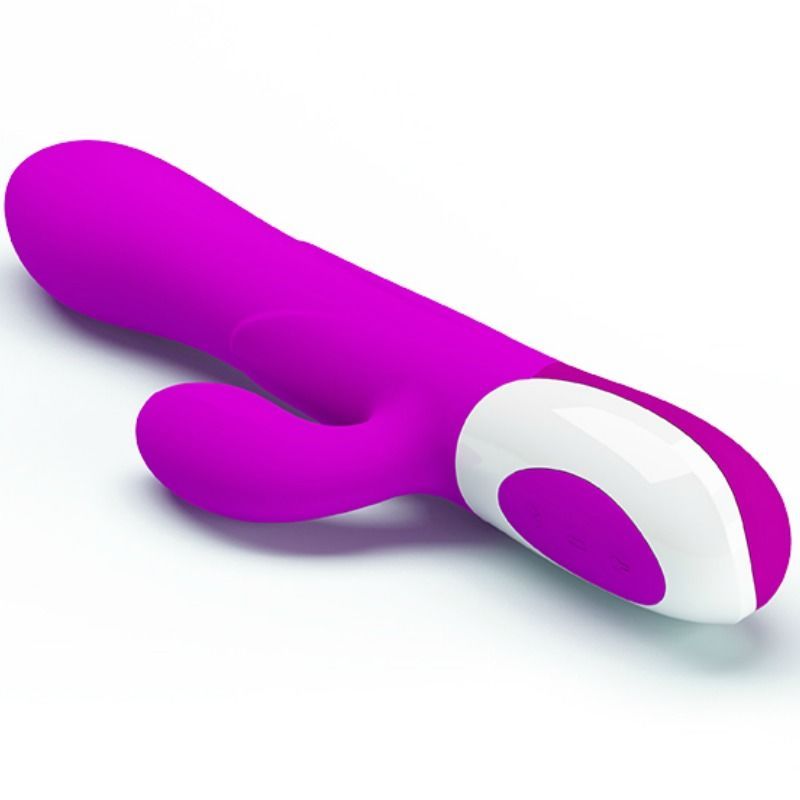 Lila Vibrator mit zwei Ohren, liegend auf weißem Hintergrund, andere Perspektive.