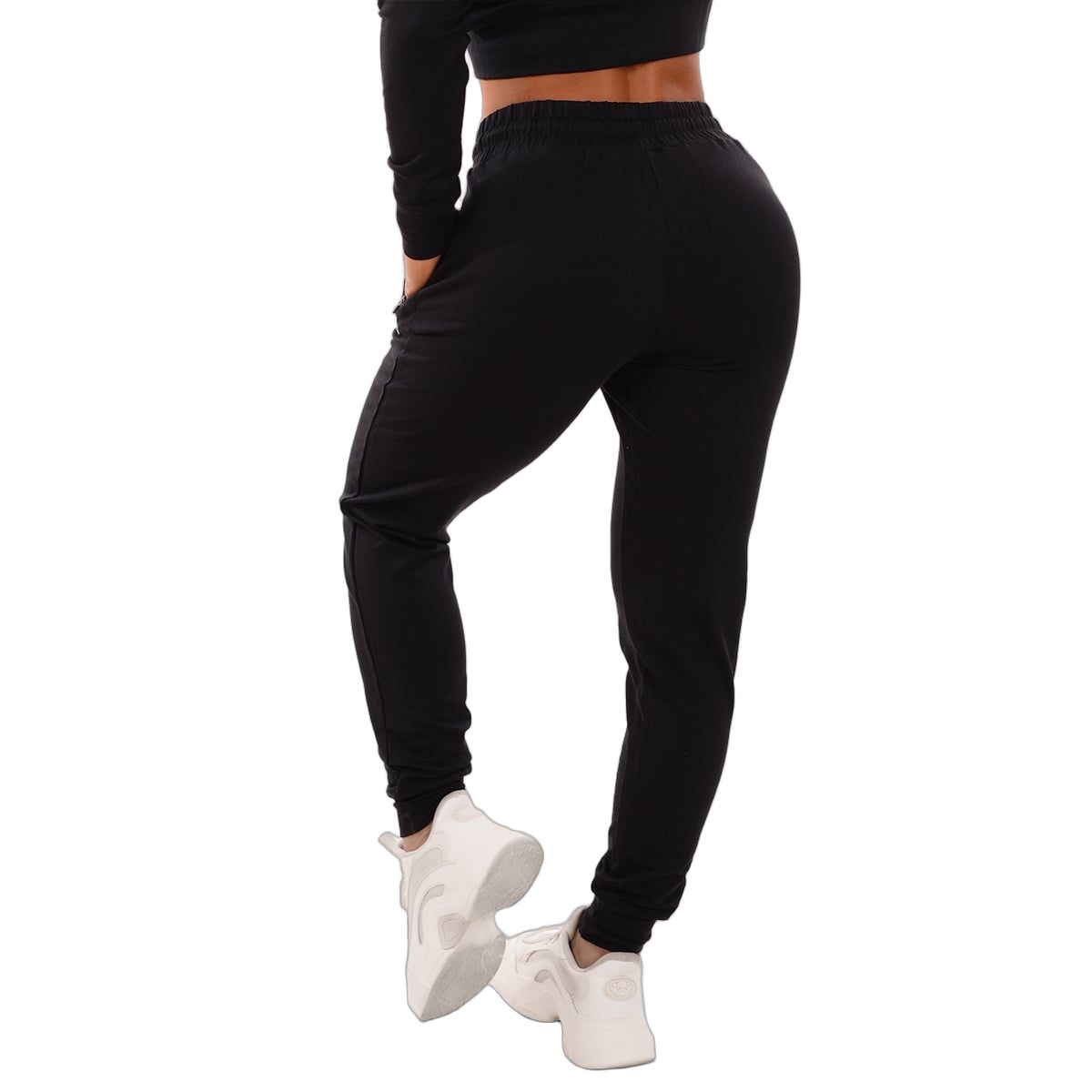 Rückansicht einer schwarzen Damen-Jogginghose mit Kordelzug und Reißverschlusstaschen.