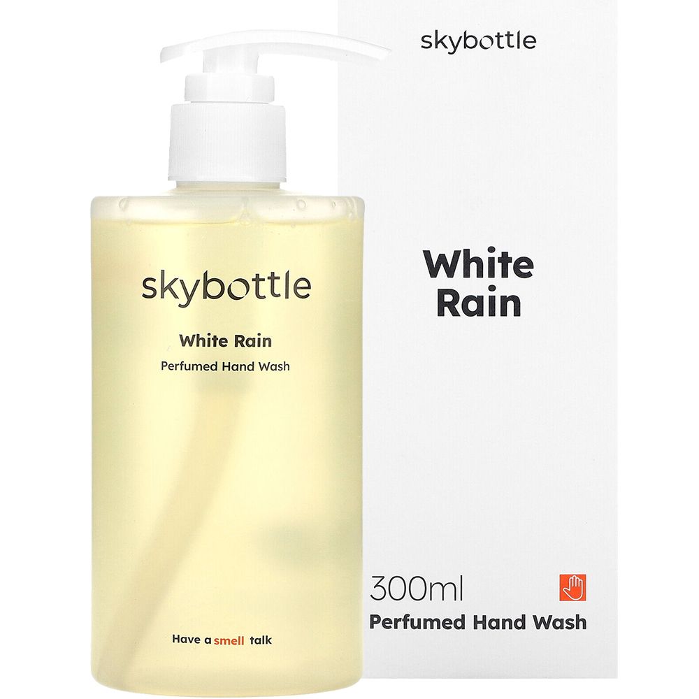 Flüssigseife mit weißem Pumpverschluss und Verpackung. Aufschrift: skybottle, White Rain, Perfumed Hand Wash. Verpackung: White Rain, 300ml.