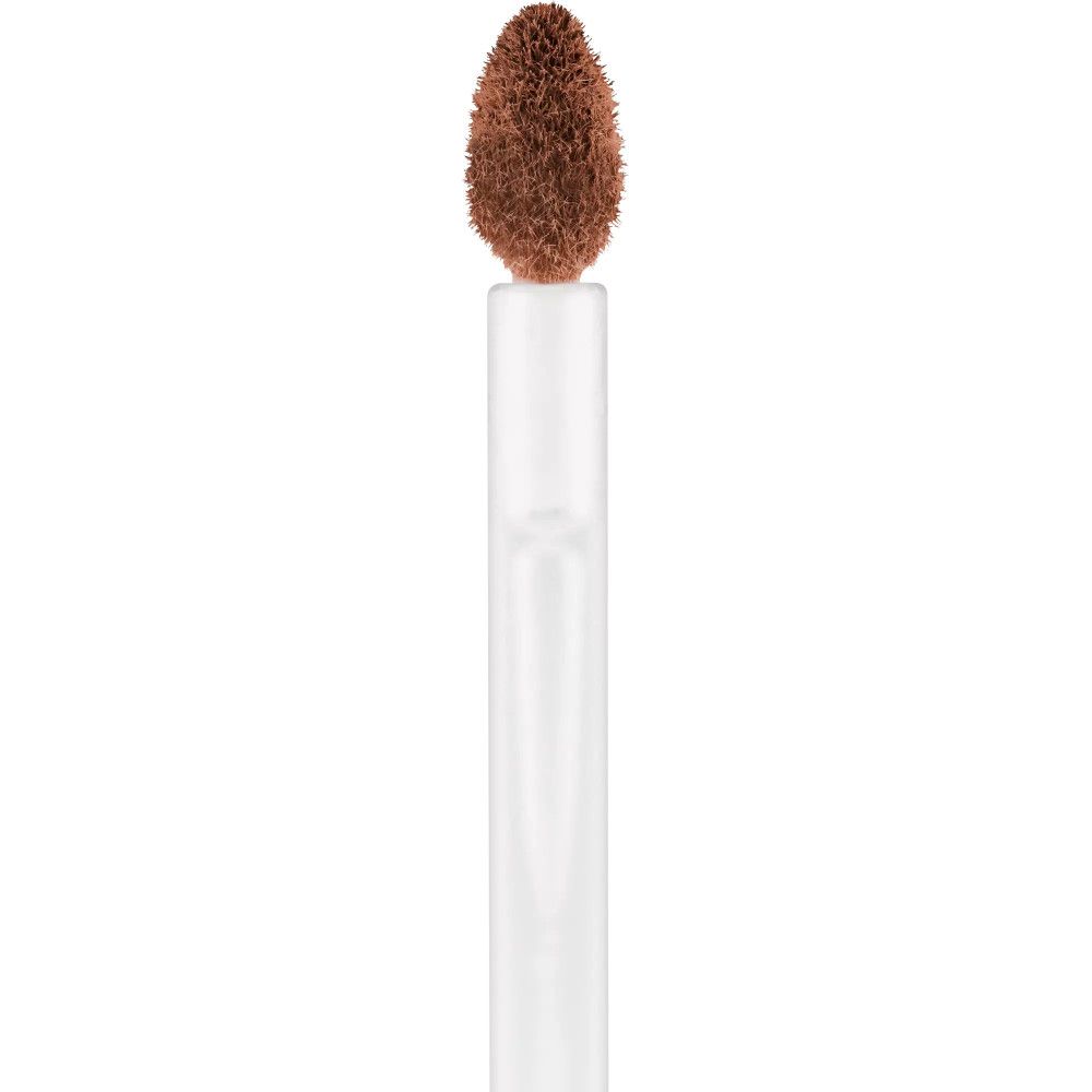 Applikatorbürste mit brauner Concealer-Spitze. Weißer Stiel.