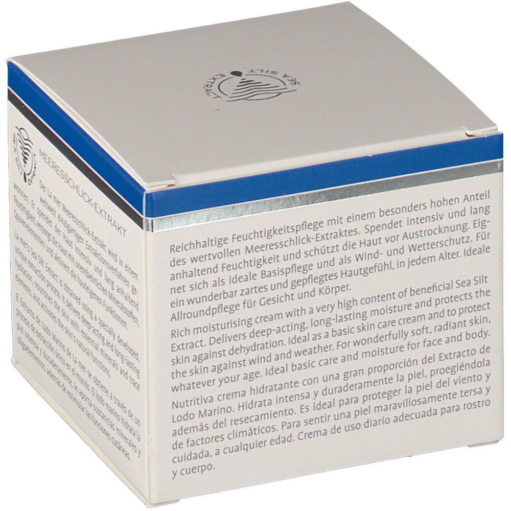 Weißer Karton mit blauem Streifen. Text: La mer, Feuchtigkeitscreme, Meeresschlick-Extrakt. Produktinformationen in Deutsch, Englisch und Spanisch.