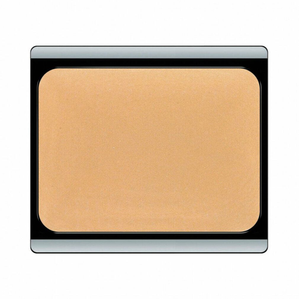 Kompakte, beige-apricotfarbene Camouflage-Creme in einer rechteckigen, schwarzen Kompaktverpackung mit silbernem Rand.