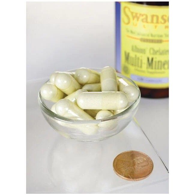 Klare Glasschale mit Kapseln. Im Hintergrund eine Flasche SWANSON Albion Chelat-Multimineral mit Eisen. Daneben eine Münze.