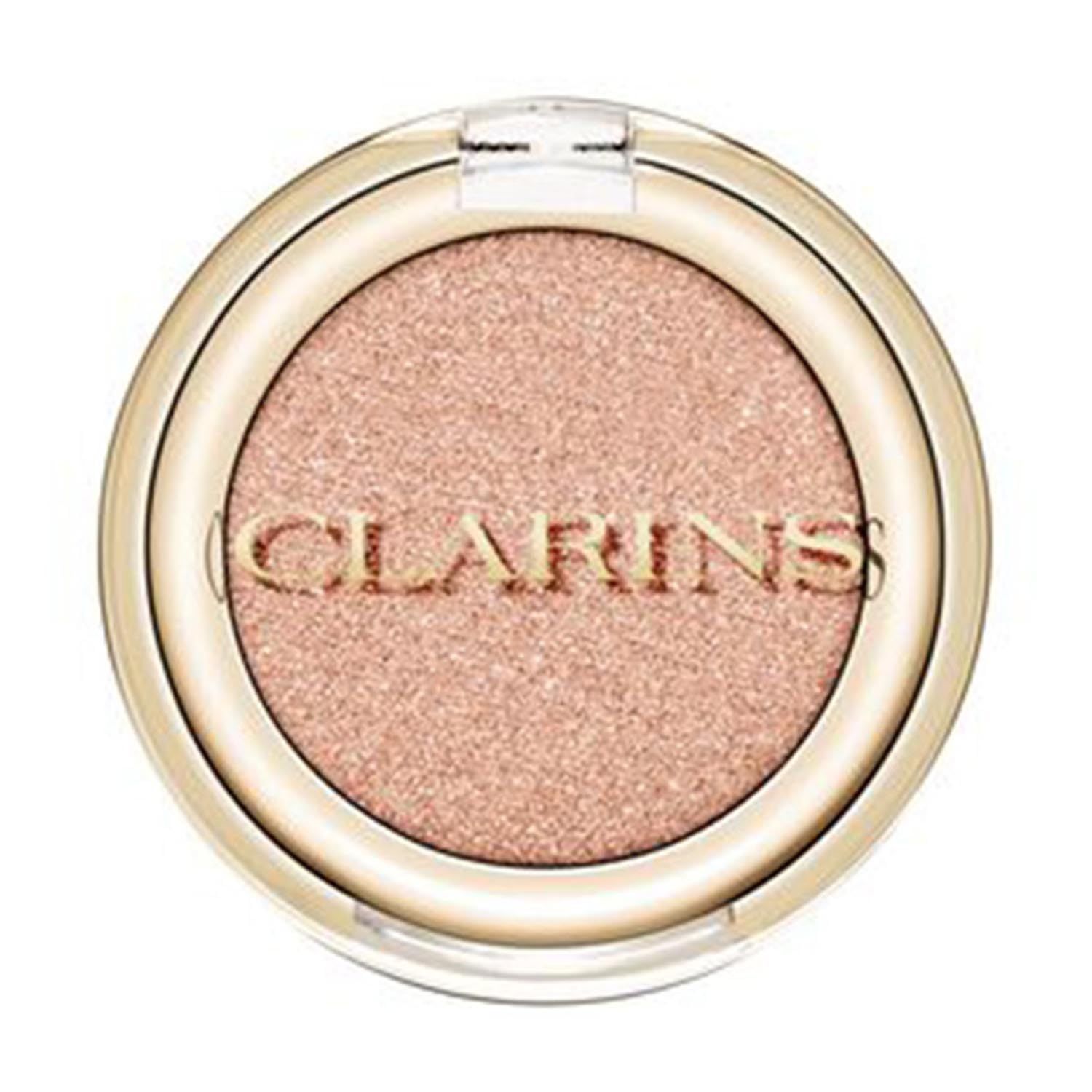 Runder, goldfarbener Lidschatten-Behälter mit rosafarbenem Inhalt. Der Deckel ist transparent. Der Markenname Clarins ist sichtbar.