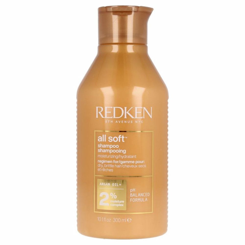 Goldfarbene Shampoo-Flasche. Aufschrift: Redken, all soft, Shampoo. Enthält Arganöl und 2% Feuchtigkeitskomplex. pH-ausgeglichen.