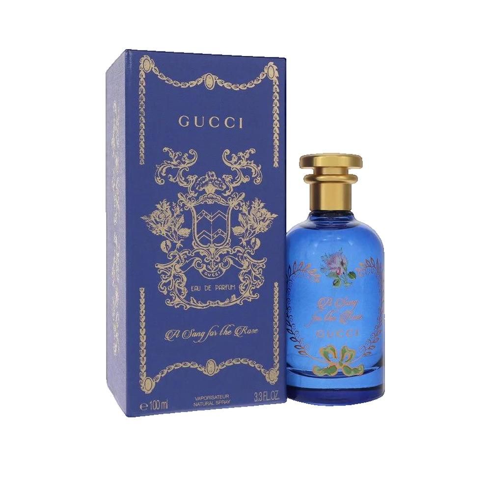 Blauer Flakon und Schachtel. Goldfarbene Details. Aufschrift: Gucci, A Song for the Rose. Eau de Parfum.