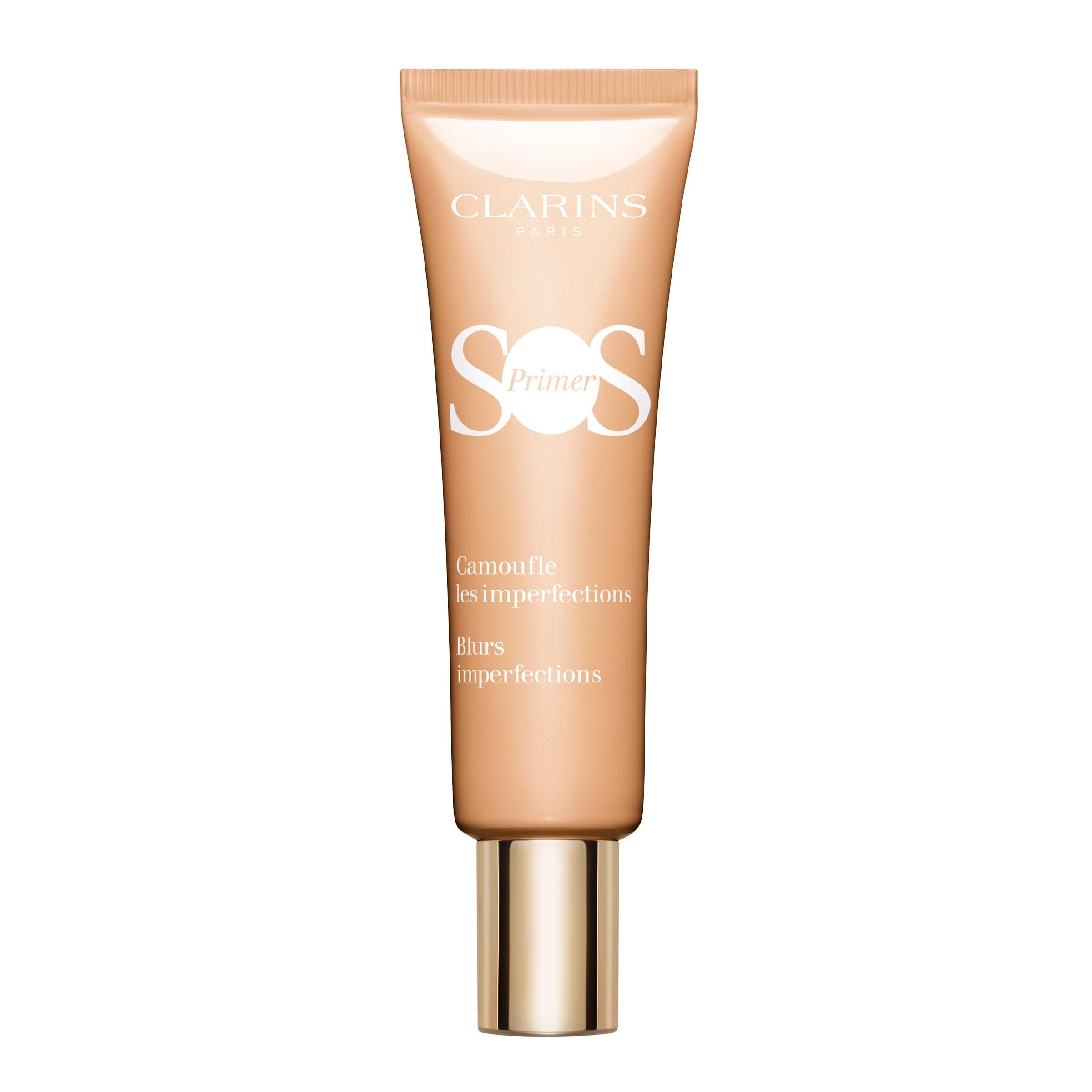 Beige Tube mit goldfarbenem Verschluss. Aufschrift: CLARINS SOS Primer. Text: Camoufle les imperfections, Blurs imperfections.
