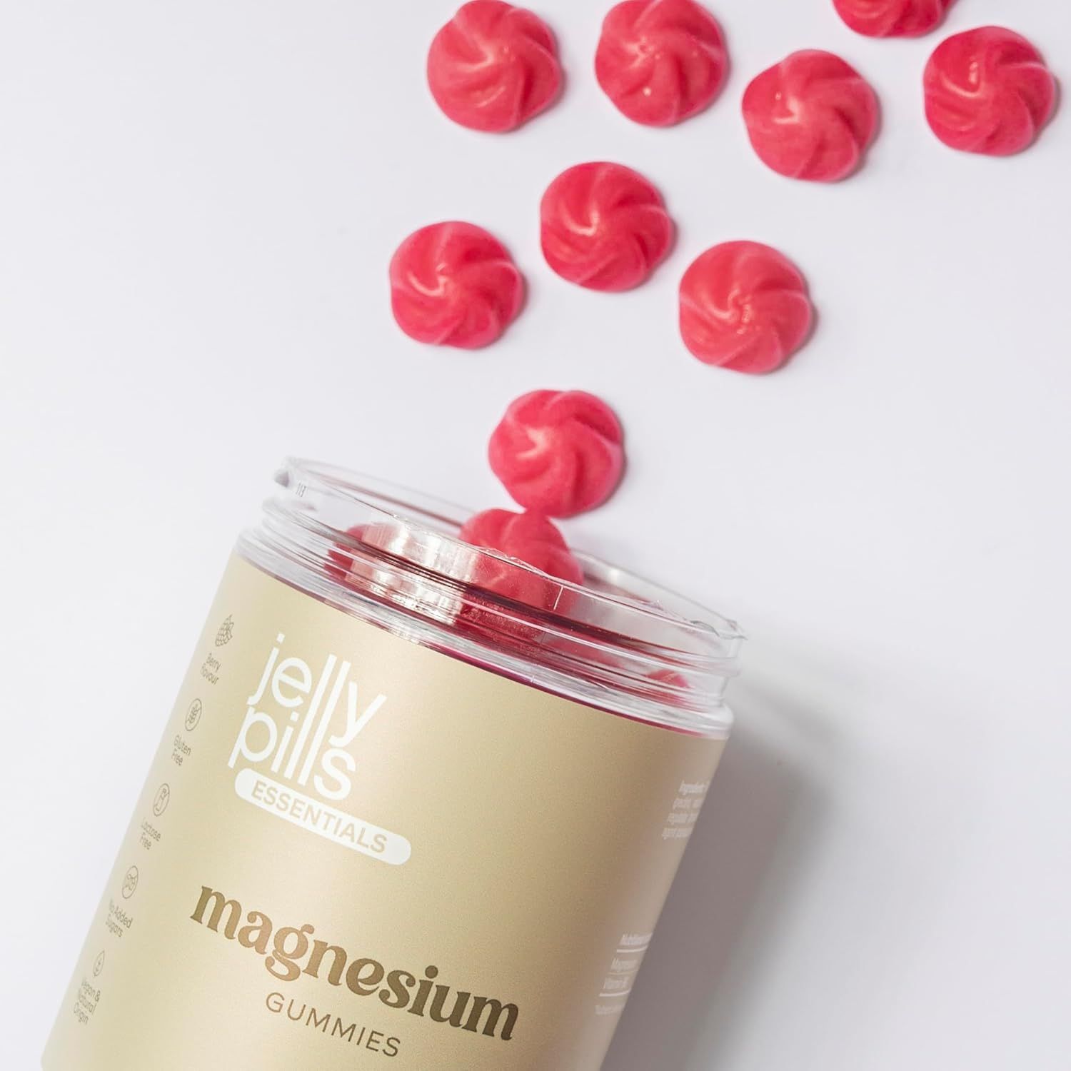 Jelly Pills Magnesium Gummibärchen, geöffnet. Gummibärchen fallen aus dem Behälter.