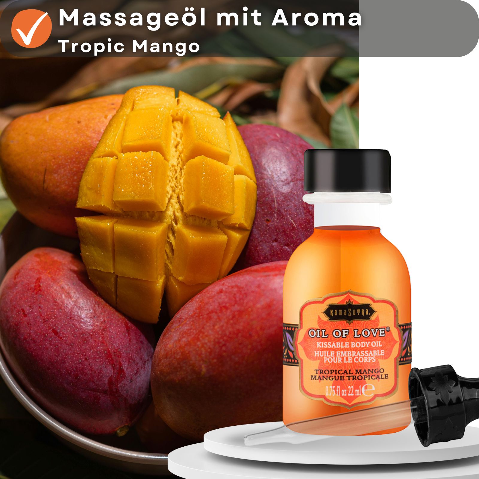 Kamasutra Öl of Love Flasche neben Mango. Text: Massageöl mit Aroma Tropic Mango. Flasche mit schwarzem Deckel und separatem Applikator.