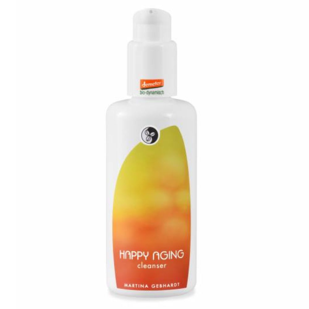 Weiße Flasche mit Pumpe. Aufschrift HAPPY AGING cleanser und Martina Gebhardt. Gelb-oranger Farbverlauf.