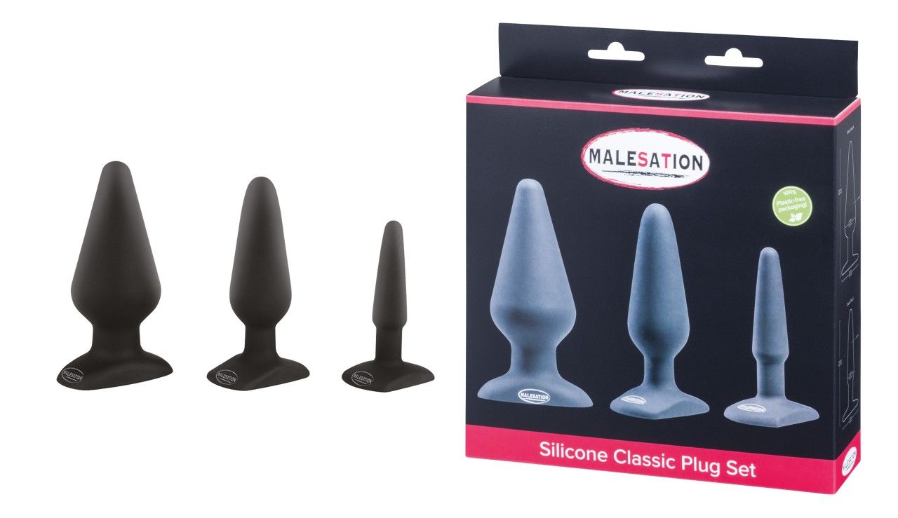 Drei schwarze Silikon-Plug in verschiedenen Größen, neben ihrer Verpackung. Die Verpackung zeigt drei graue Plugs und den Produktnamen.