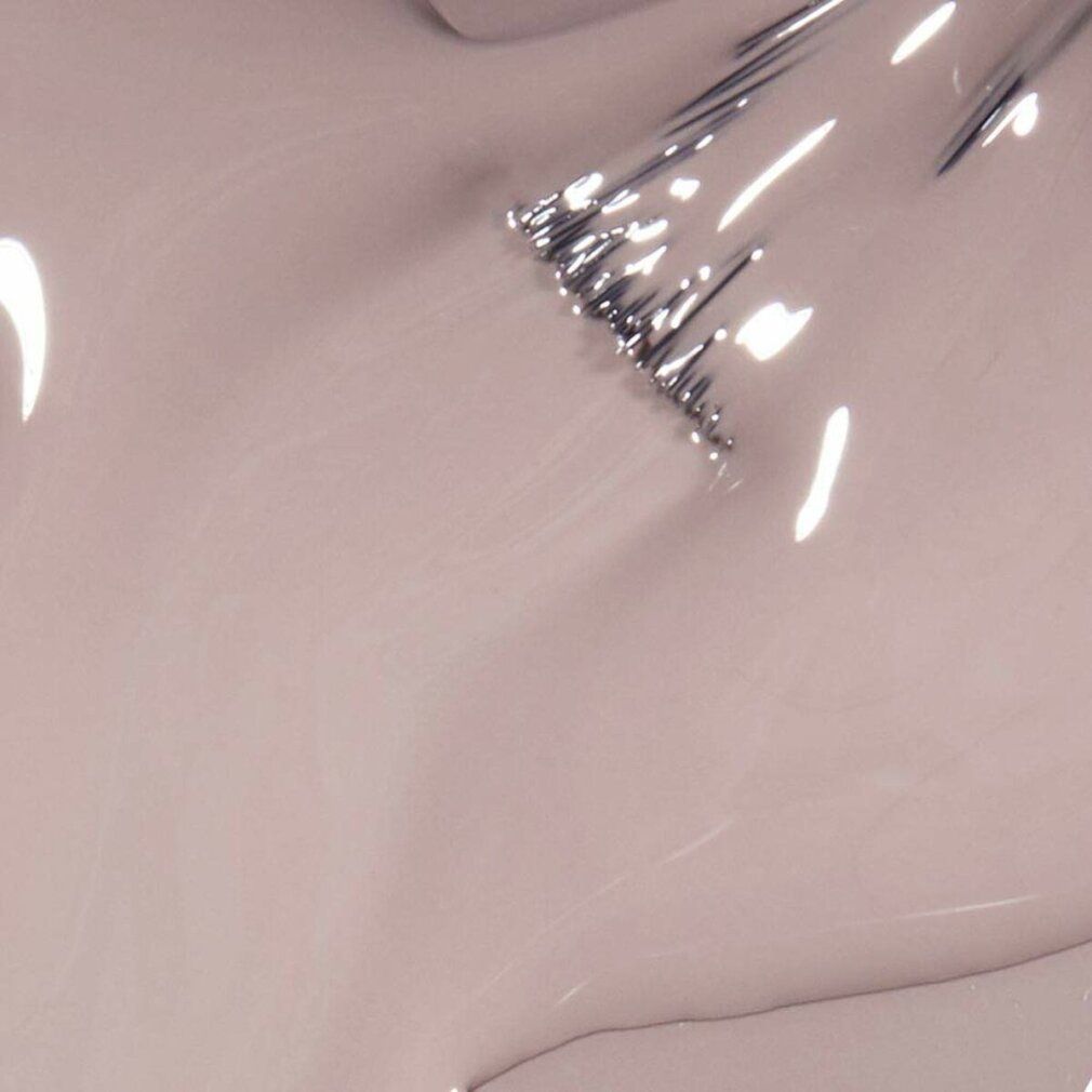 Nahaufnahme von Nagellack. Farbe: Beige. Pinsel mit Lack benetzt.