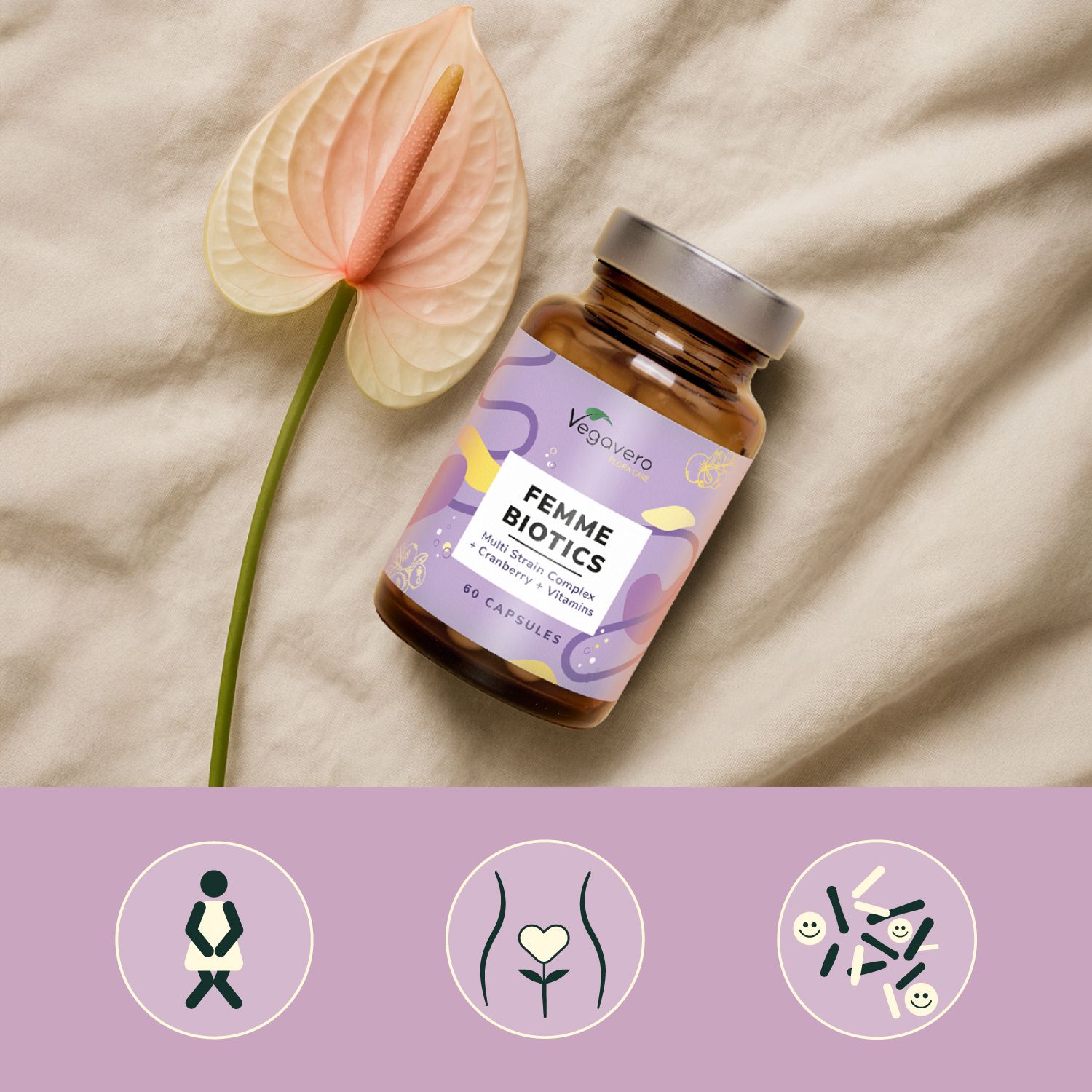 Braune Flasche FEMME BIOTICS neben einer Blume. Auf einem beigen Stoff. Drei Icons unten.