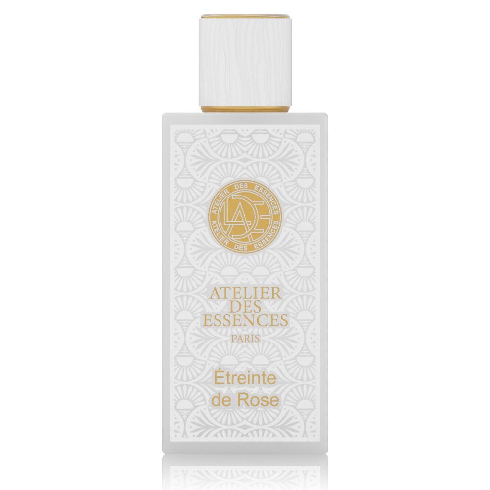 Rechteckige Flasche mit weißem Etikett und goldenem Deckel. Text: Atelier des Essences, Étreinte de Rose.