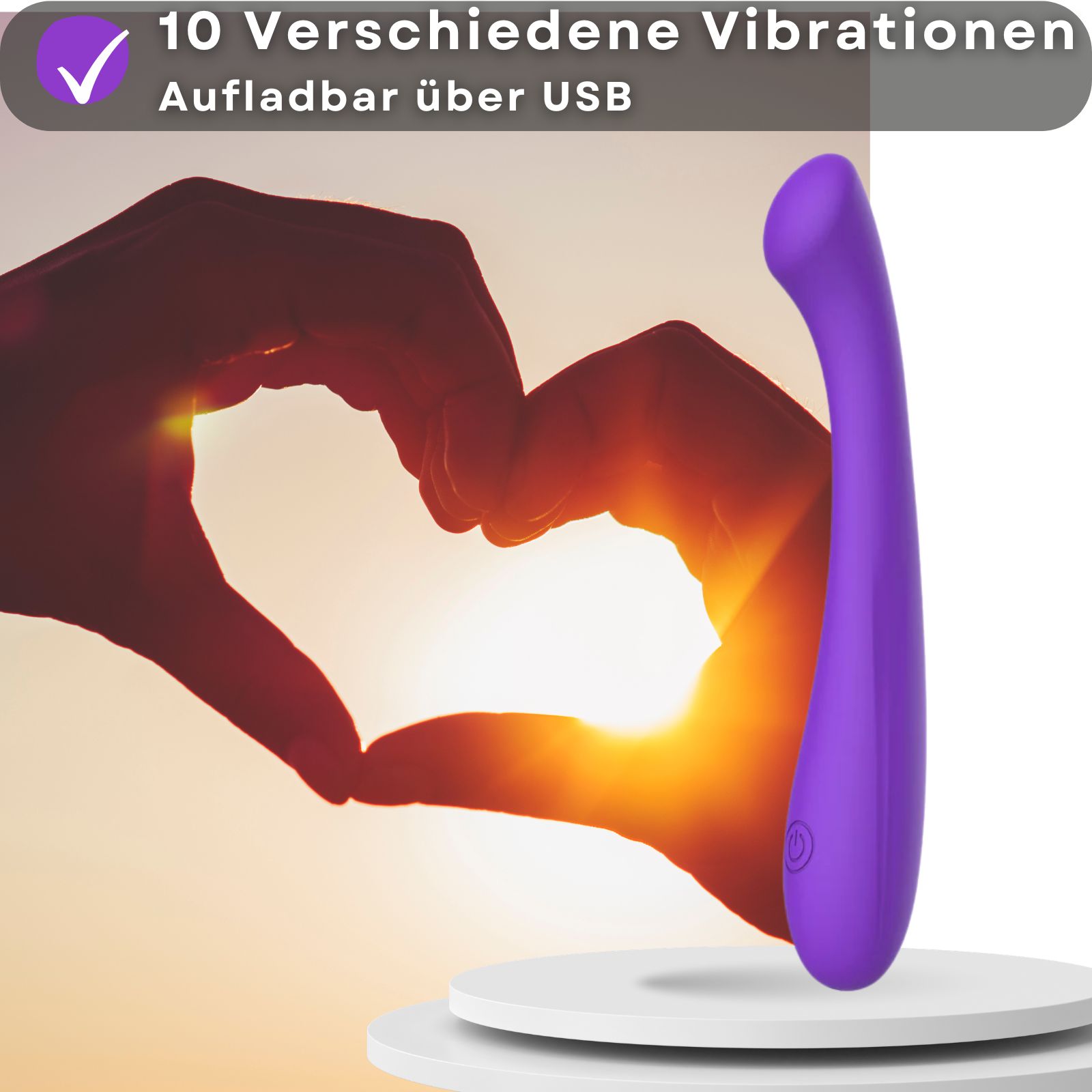 Lila Vibrator. Text mit Eigenschaften: 10 Modi, USB. Hände formen Herz.