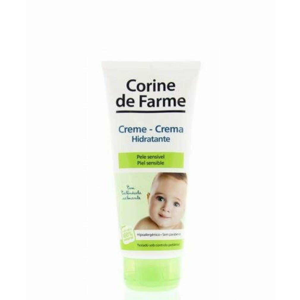 Creme-Tube mit Produktnamen und Babyfoto. Text: Creme-Crema Hidratante, für empfindliche Haut. Grün-weiße Verpackung.