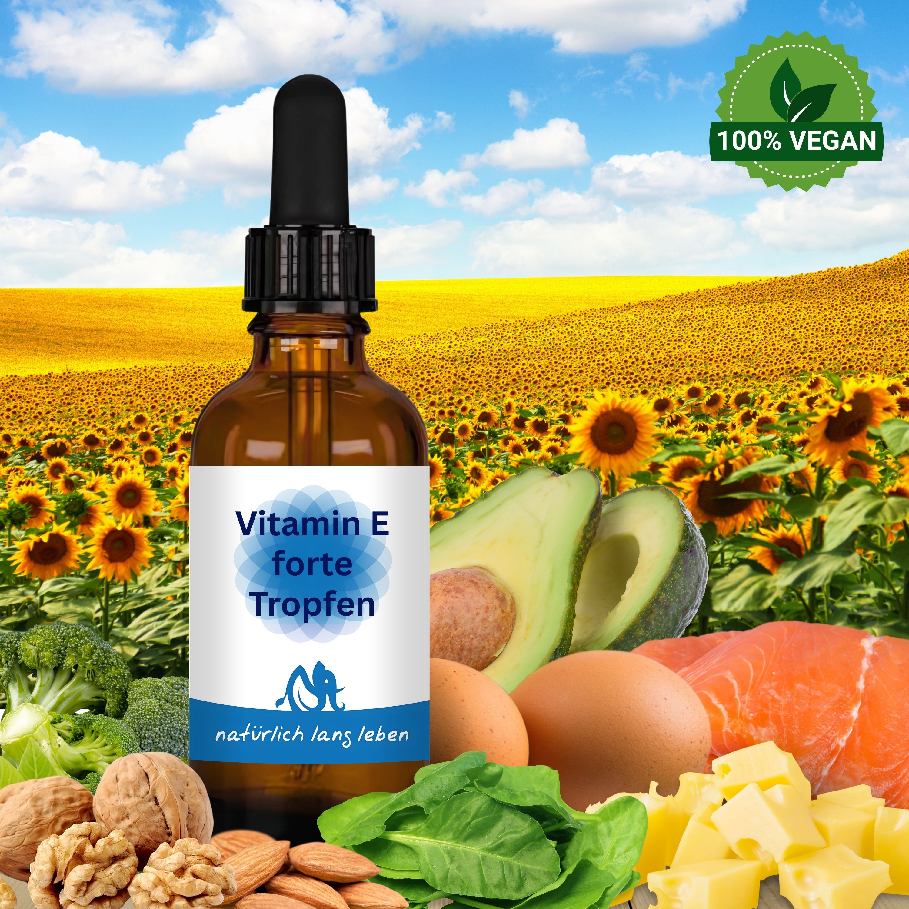 Braune Glasflasche mit Tropfer vor Sonnenblumenfeld. Auf dem Etikett: "Vitamin E forte Tropfen". Zusätzliche Lebensmittel.