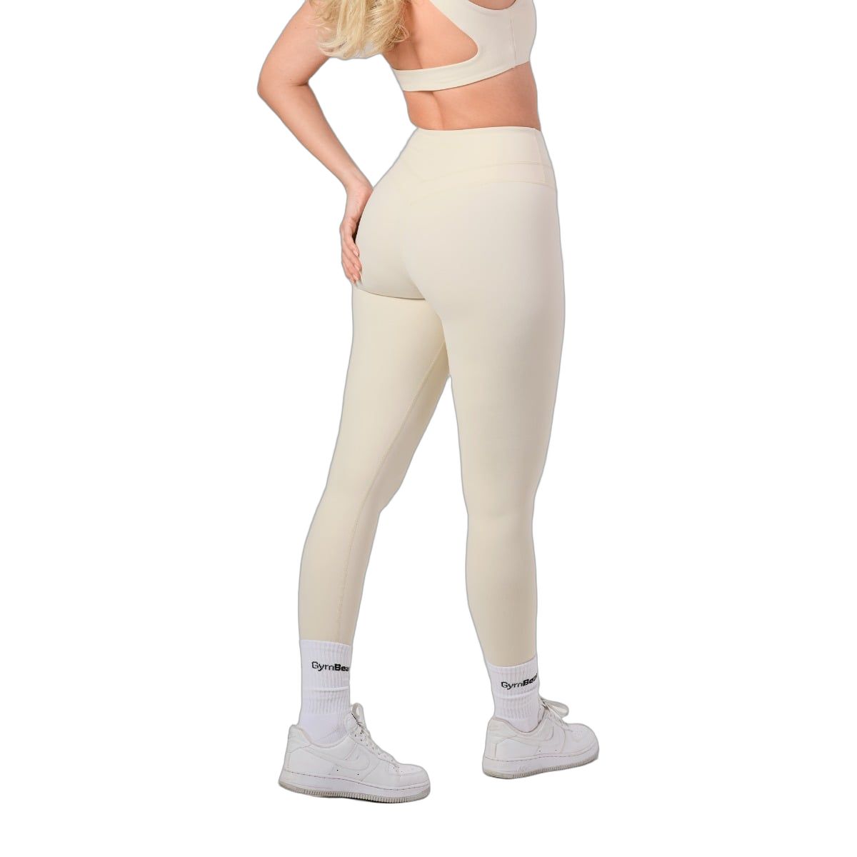Damen-Leggings in hellem Beige, hohe Taille, nahtlos, mit GymBeam-Logo auf den Socken.