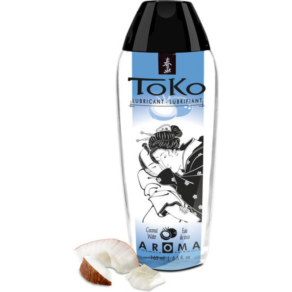 ToKo Aroma Kokoswasser Gleitmittel in transparenter Flasche mit schwarzem Verschluss. Kokosnussstücke daneben.
