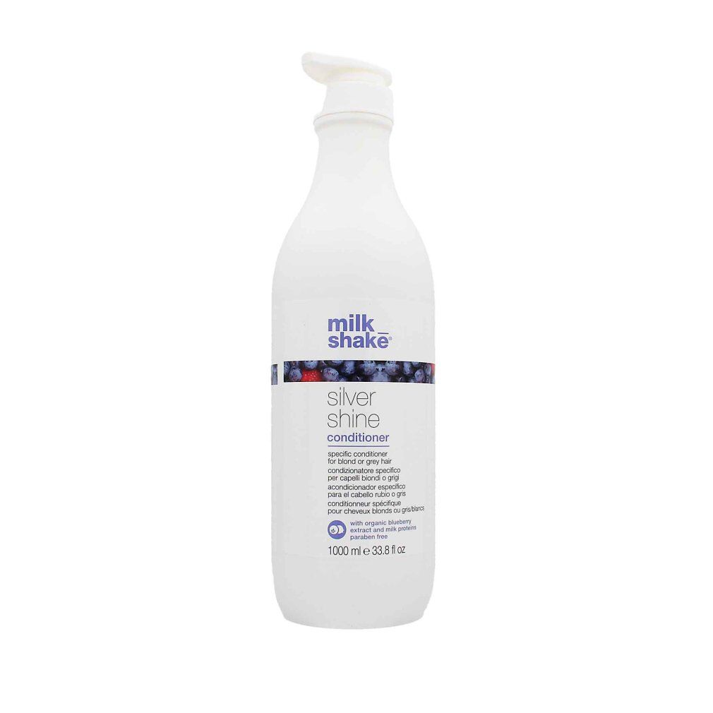 Weiße Flasche mit Pumpe. Aufschrift: milk_shake Silver shine conditioner. Enthält Blaubeerextrakt. 1000 ml.