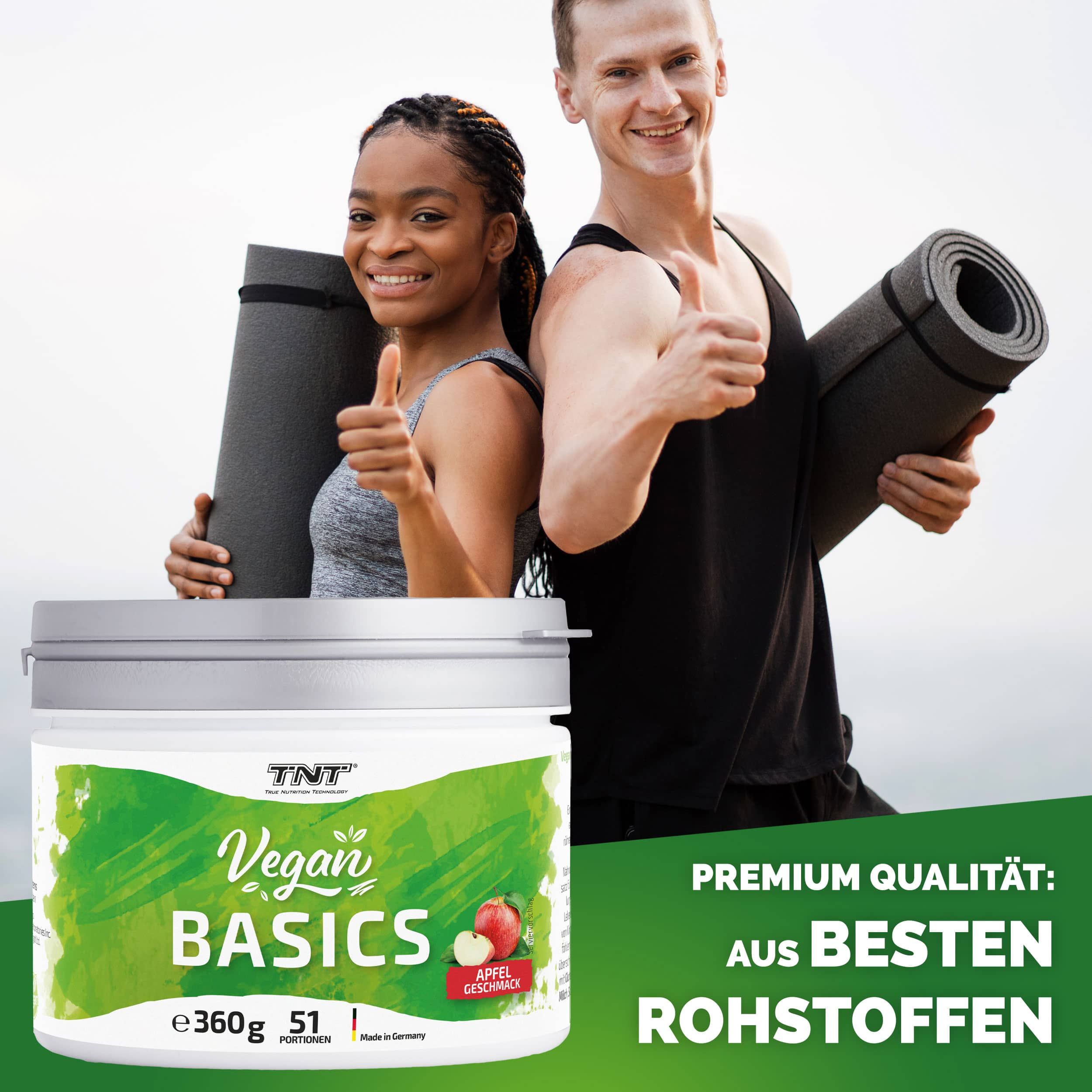 Behältnis mit Deckel. Aufschrift: Vegan Basics, Apfel Geschmack, 360g, 51 Portionen. Logo TNT. Zwei Personen mit Daumen hoch.