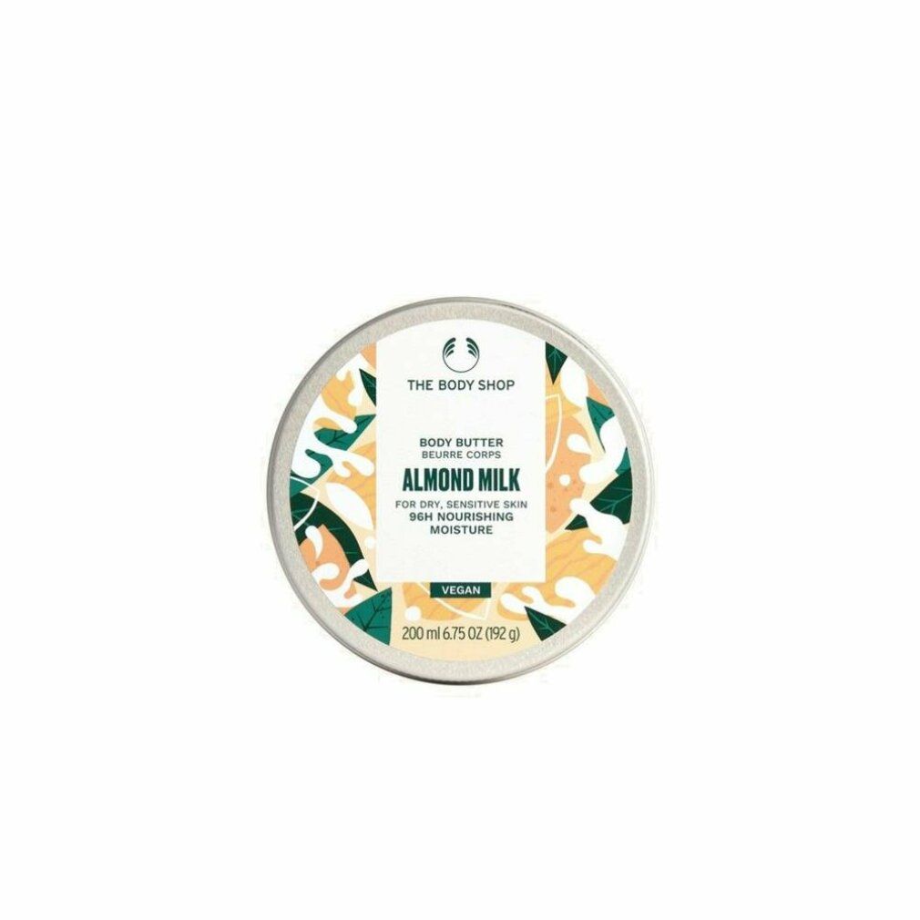 Runde Dose mit Deckel. Aufschrift: The Body Shop, Body Butter Almond Milk. Für trockene, empfindliche Haut. Vegan. 200 ml.
