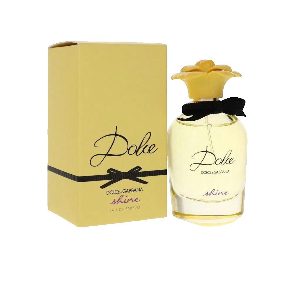 Gelbe Parfumflasche mit gelbem Blütenverschluss und schwarzer Schleife. Gelbe Verpackung mit Schriftzug.