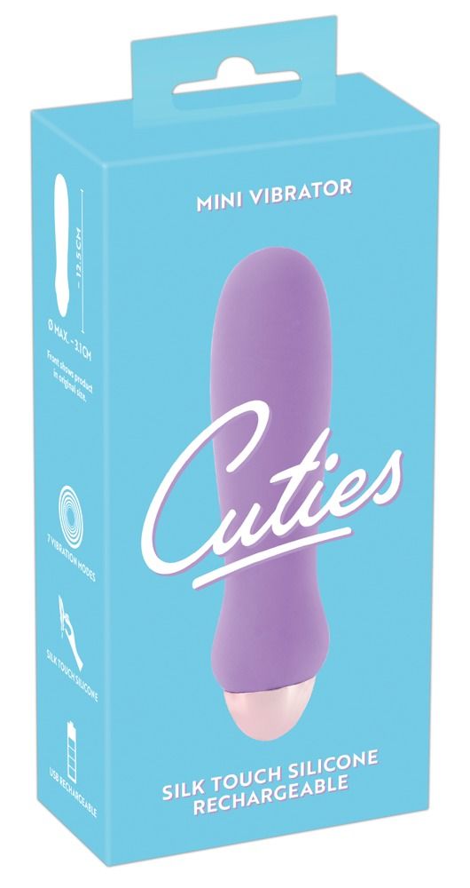 Verpackung eines lila Mini-Vibrators. Vorderseite zeigt Produkt und Text 'Cuties', 'Mini Vibrator', 'Silk Touch Silicone Rechargeable'.