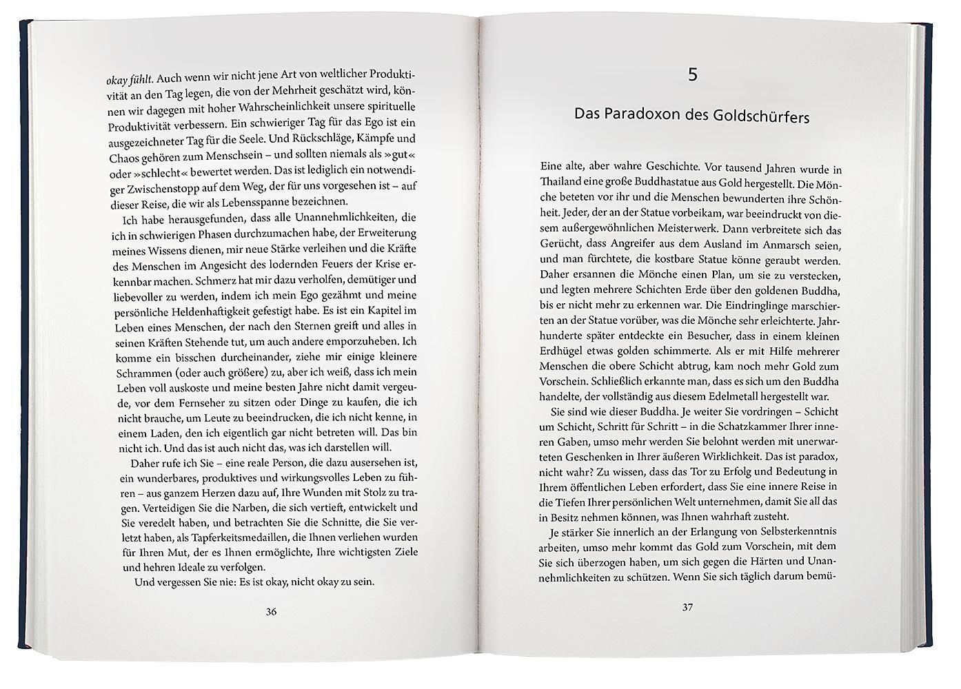 Buch aufgeschlagen. Doppelseite mit Text in deutscher Sprache. Seitenzahlen. Schwarze Schrift auf weißem Papier.