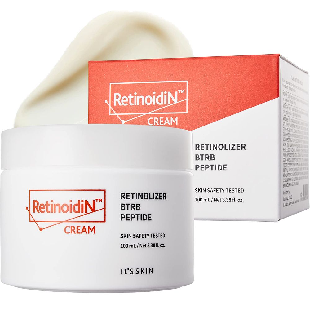 Weißer Tiegel und Schachtel mit Logo "Retinoidin" und Text. Creme-Ausstrich oben. "Skin Safety Tested" und "IT'S SKIN".