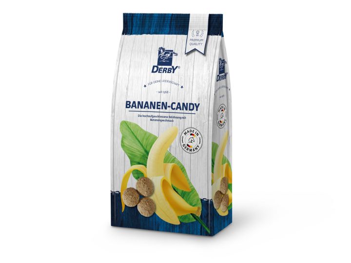 Verpackung von DERBY Bananen-Candy. Abgebildet sind eine Banane, Blätter und runde Süßigkeiten. Aufschrift: BANANEN-CANDY, Made in Germany.