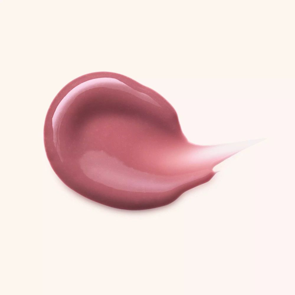 Ausgestrichene Lipgloss-Probe. Rosa Farbton mit glänzendem Finish.