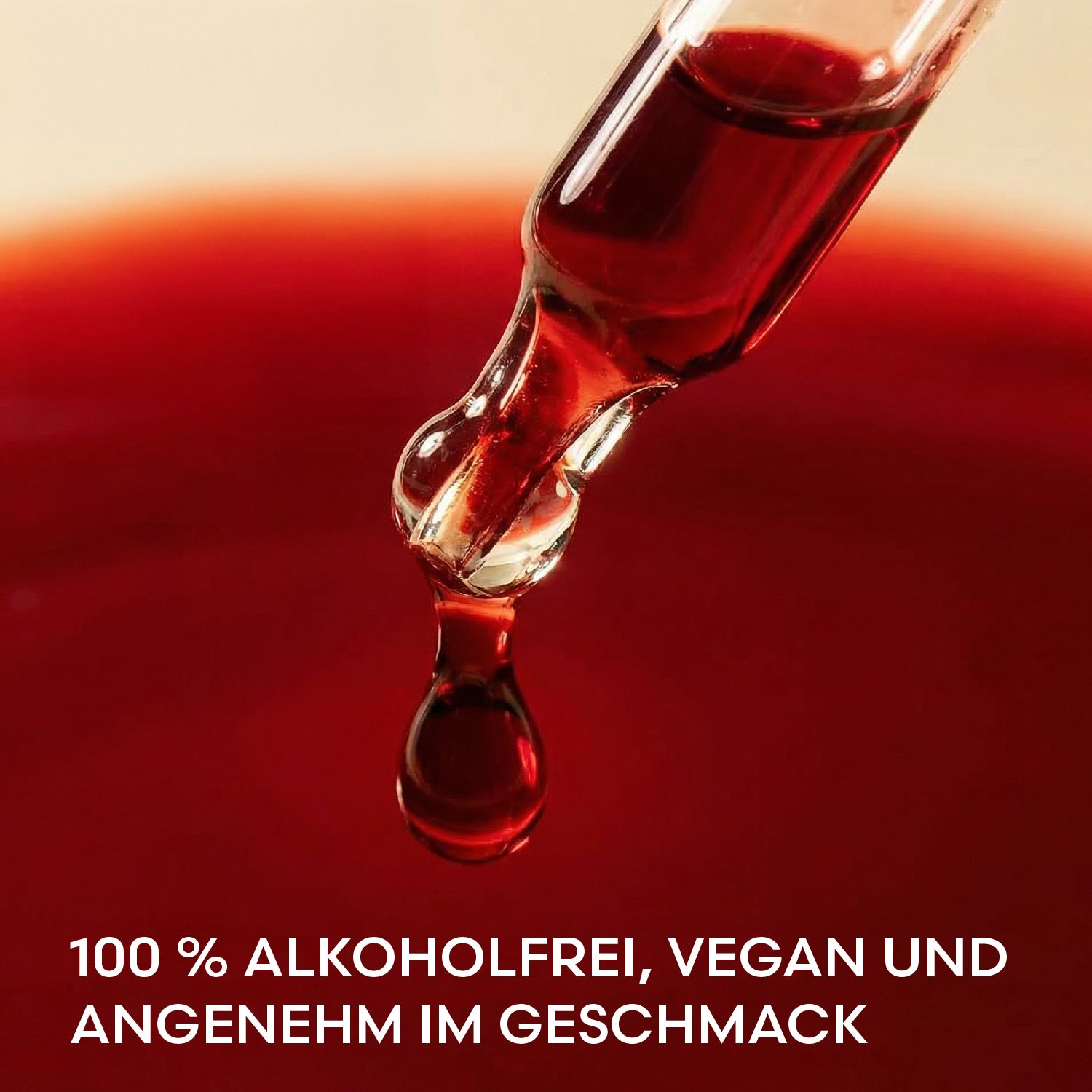 Tropfen aus einer Pipette. Rote Flüssigkeit. Text: 100% alkoholfrei, vegan und angenehm im Geschmack.
