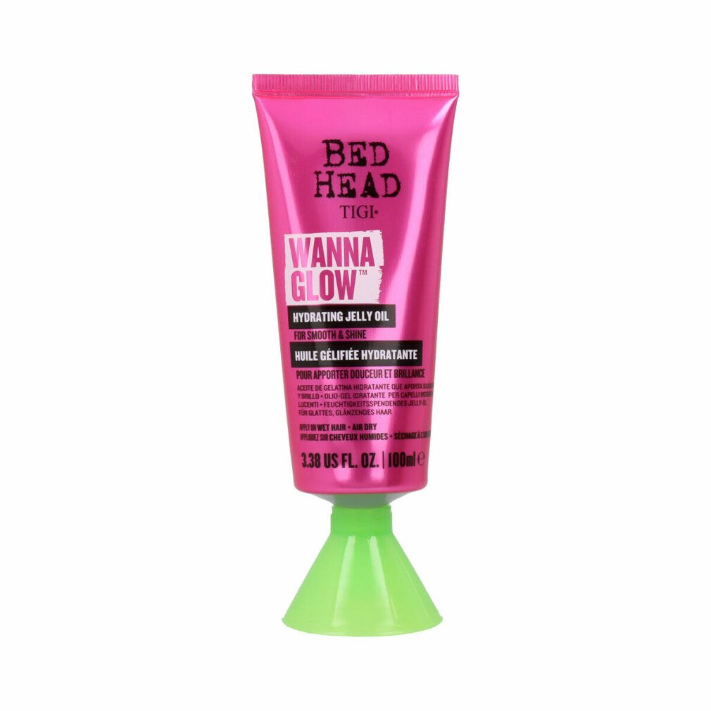 Rosa Tube mit grüner Basis. Bed Head Tigi Wanna Glow Hydrating Jelly Oil. Text auf Englisch und Französisch.