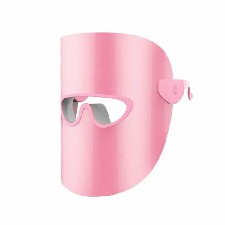 Rosa LED-Lichttherapiemaske. Form: Maske mit Augenausschnitt. Seitlich ein Knopf.