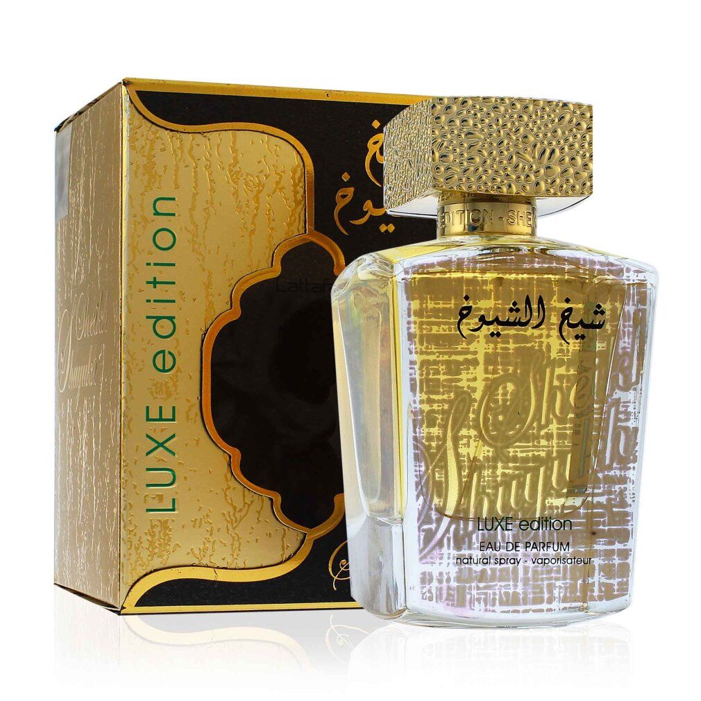 Parfümflasche und Verpackung. Goldfarbene Verpackung mit schwarzem Element und arabischer Schrift. Flasche mit goldenem Verschluss.