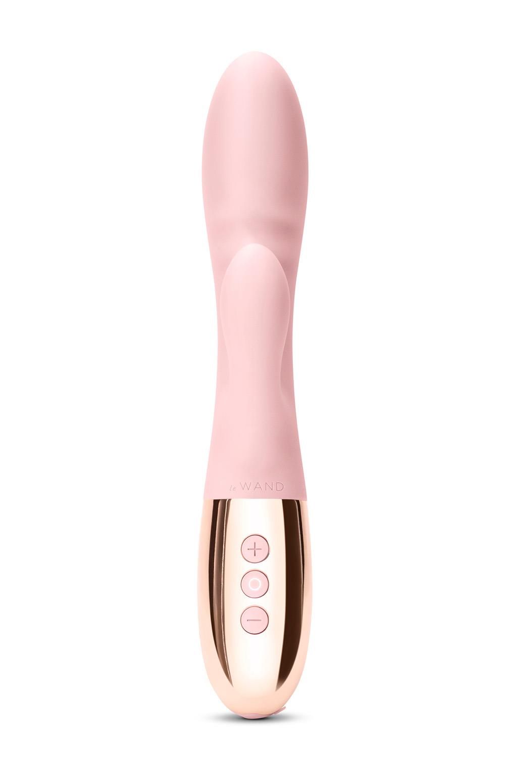 Rosa Vibrator mit goldfarbenem Sockel. Drei Knöpfe.  Der obere Teil hat eine gebogene Form.