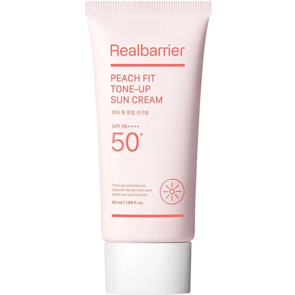 Rosa Tube mit weißem Verschluss. Aufschrift: Realbarrier Peach Fit Tone-Up Sun Cream SPF 50+ PA++++. Sonnenblumen-Symbol.