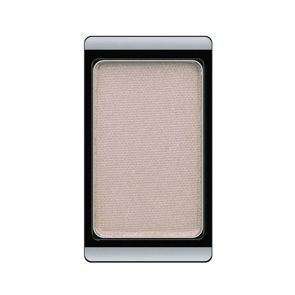 Ein einzelner Lidschatten in einem schwarzen Behälter. Die Farbe ist hell und schimmernd.