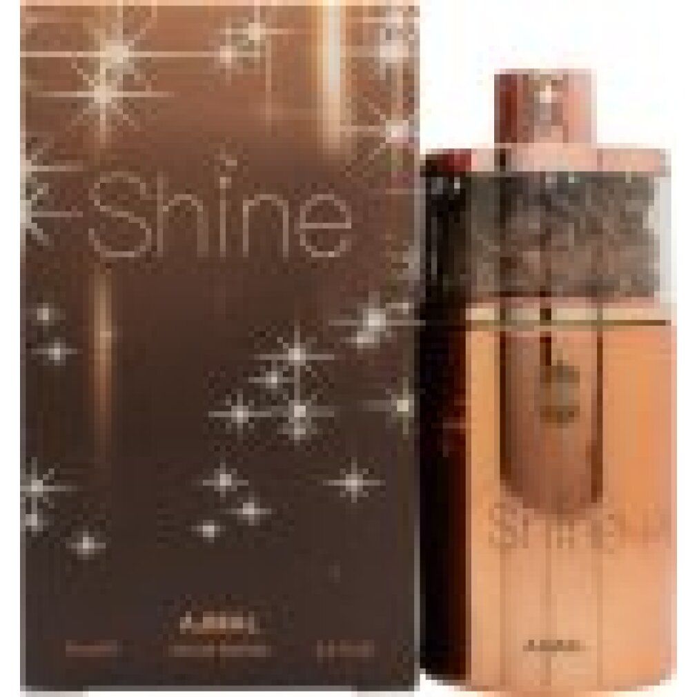 Parfümflasche und Schachtel. Flasche und Schachtel stehen nebeneinander. Auf der Schachtel steht Shine. Die Flasche ist goldfarben.