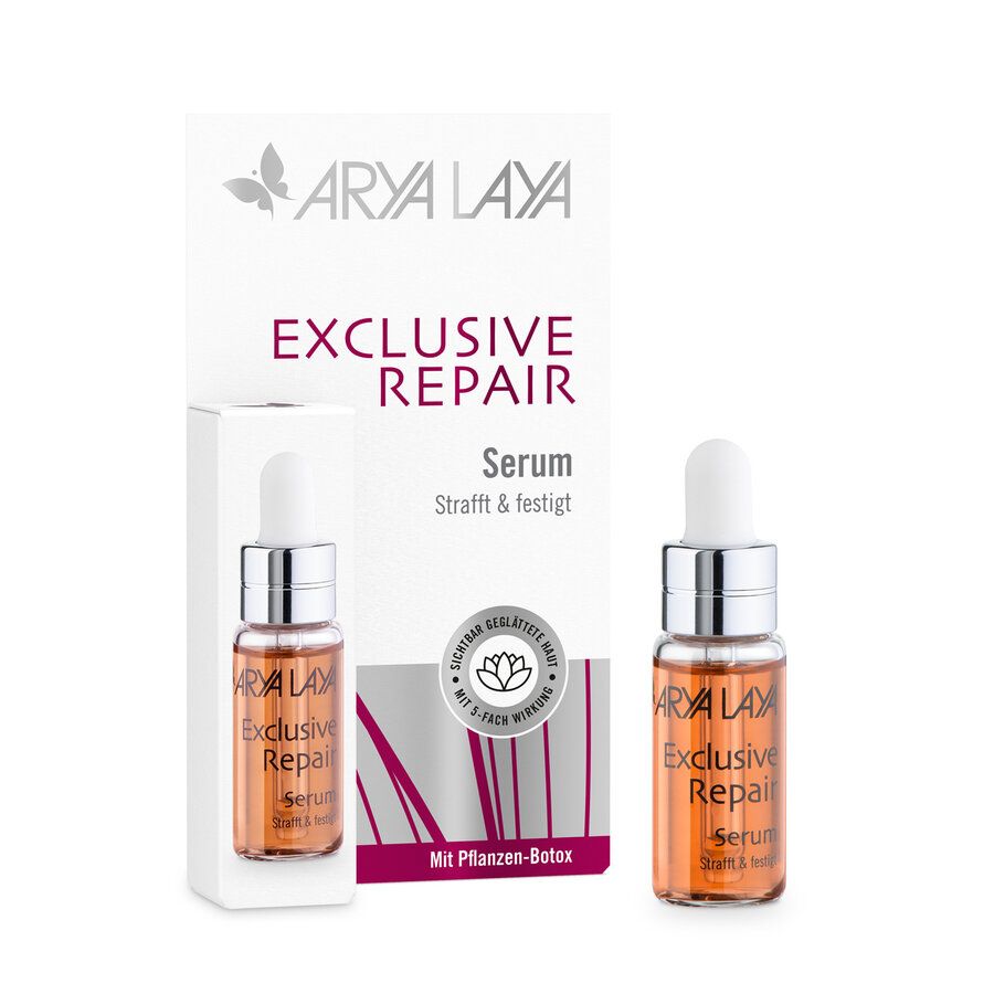 Arya Laya Exclusive Repair Serum Probiergröße: Zwei kleine Glasfläschchen mit Pipettenverschluss, gefüllt mit bernsteinfarbener Flüssigkeit. Eines steht neben einer geöffneten Produktverpackung.