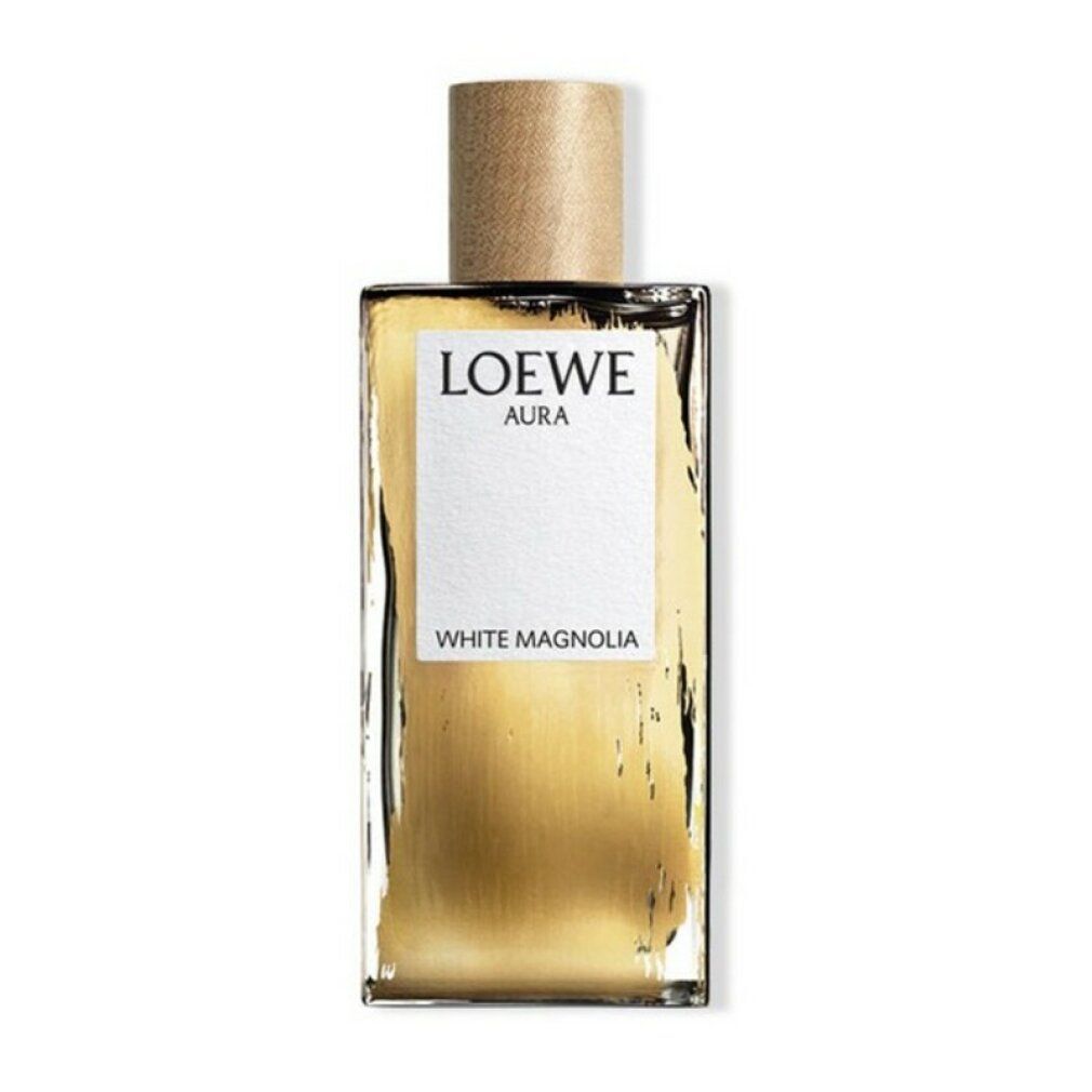 Rechteckiger Flakon mit Holzverschluss. Auf weißem Etikett: LOEWE AURA, WHITE MAGNOLIA. Goldfarbene Flüssigkeit sichtbar.