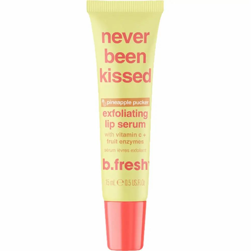 Gelbe Tube mit roter Kappe. Aufschrift: "never been kissed", "exfoliating lip serum" und "b.fresh".