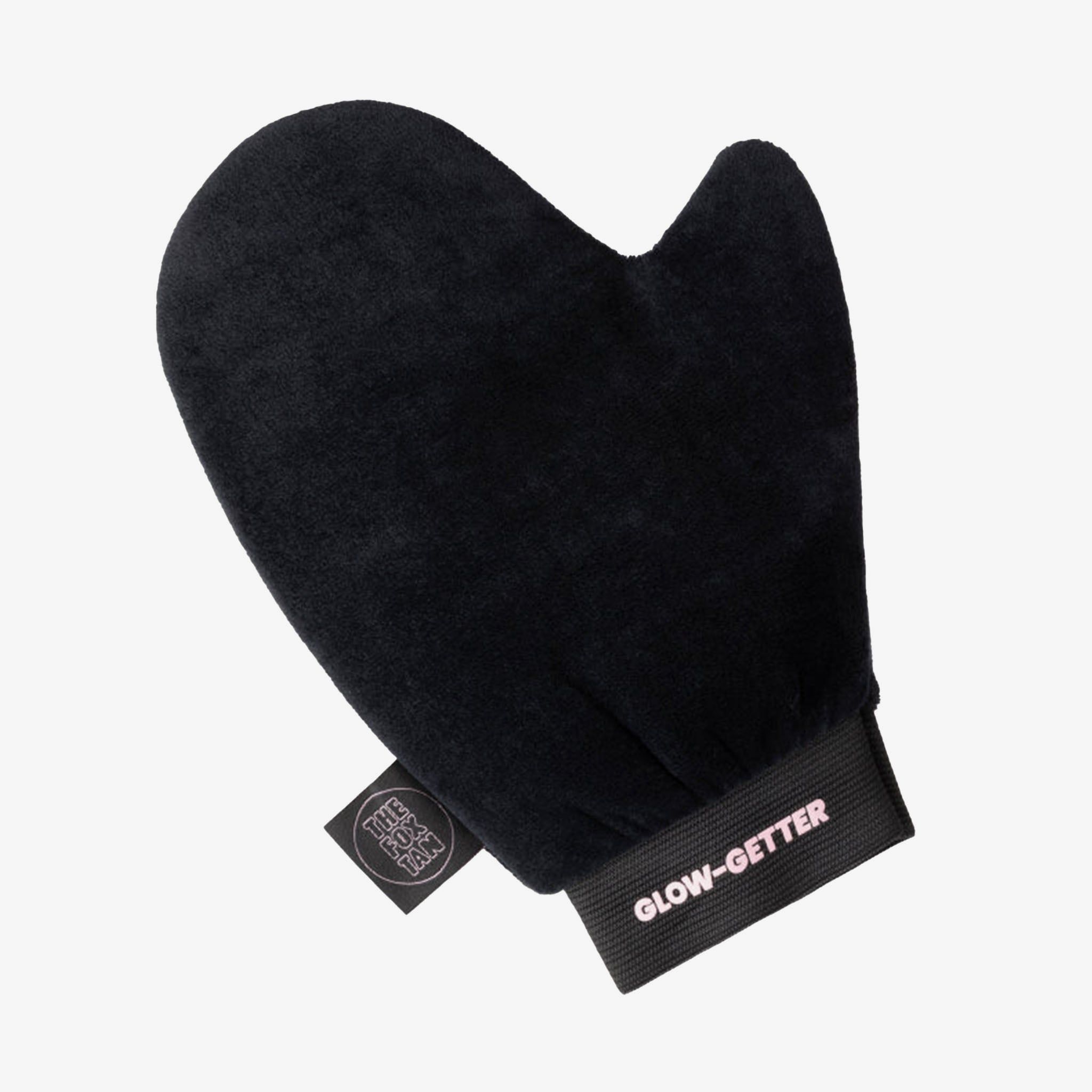 Schwarzer, samtiger Handschuh mit Gummiband und Aufschrift "GLOW-GETTER". Kleines Label mit Logo.